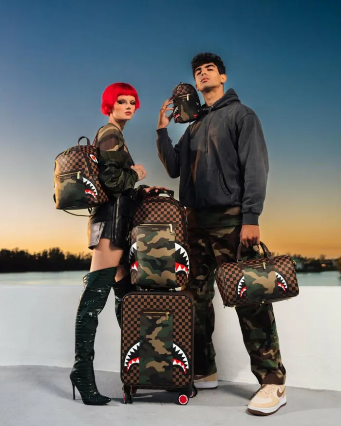 EXTERIOR GOLD ZIP POCKET SHARKS IN PARIS SAVAGE BACKPACK Bags SPRAYGROUND